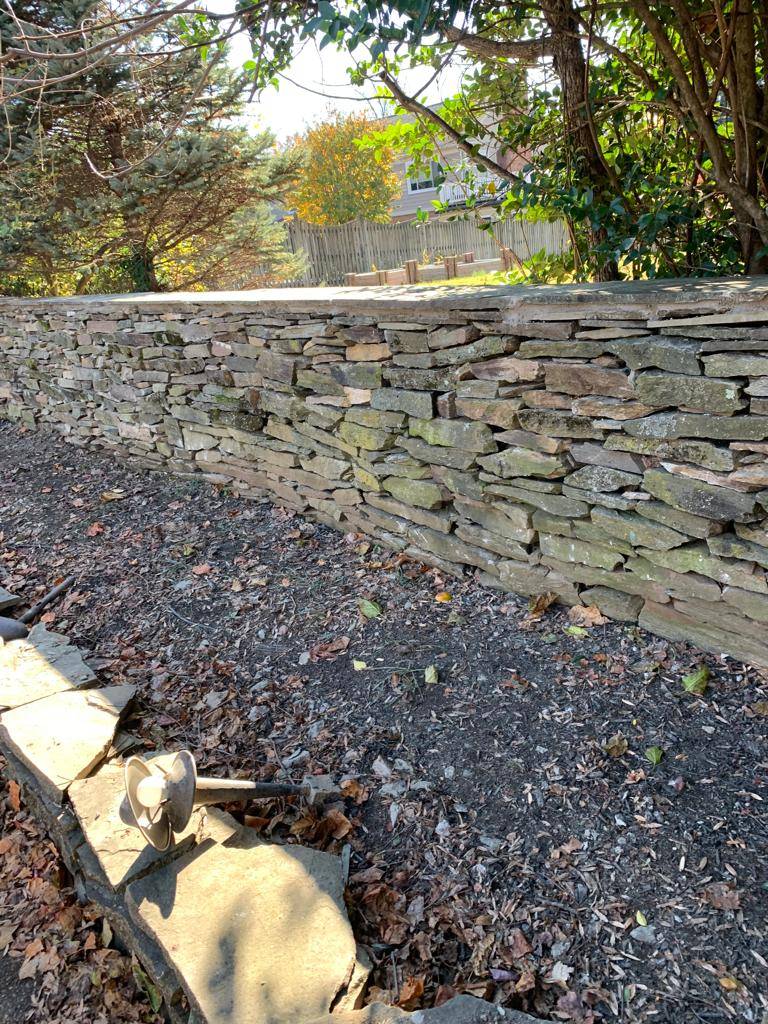 Why do property owners require retaining wall service?